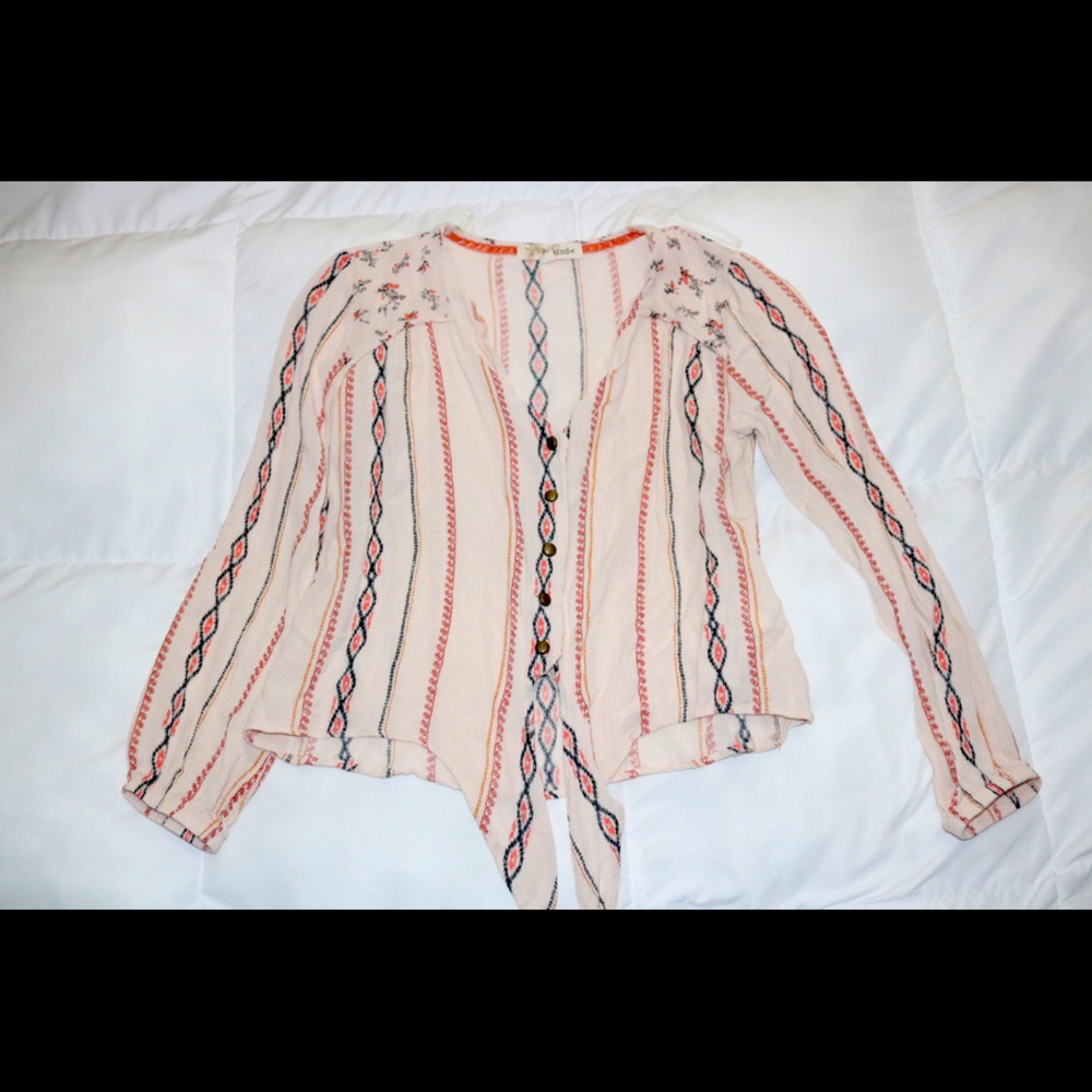 pink blouse with tribal pattern